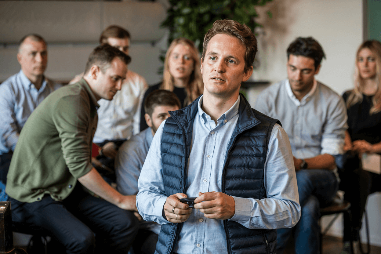 Startup Founder Struggling to Capture Customer Interest A startup founder presenting a product to a group of disinterested customers, illustrating poor product-market fit.